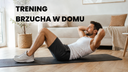mężczyzna wykonujący brzuszki w domu
